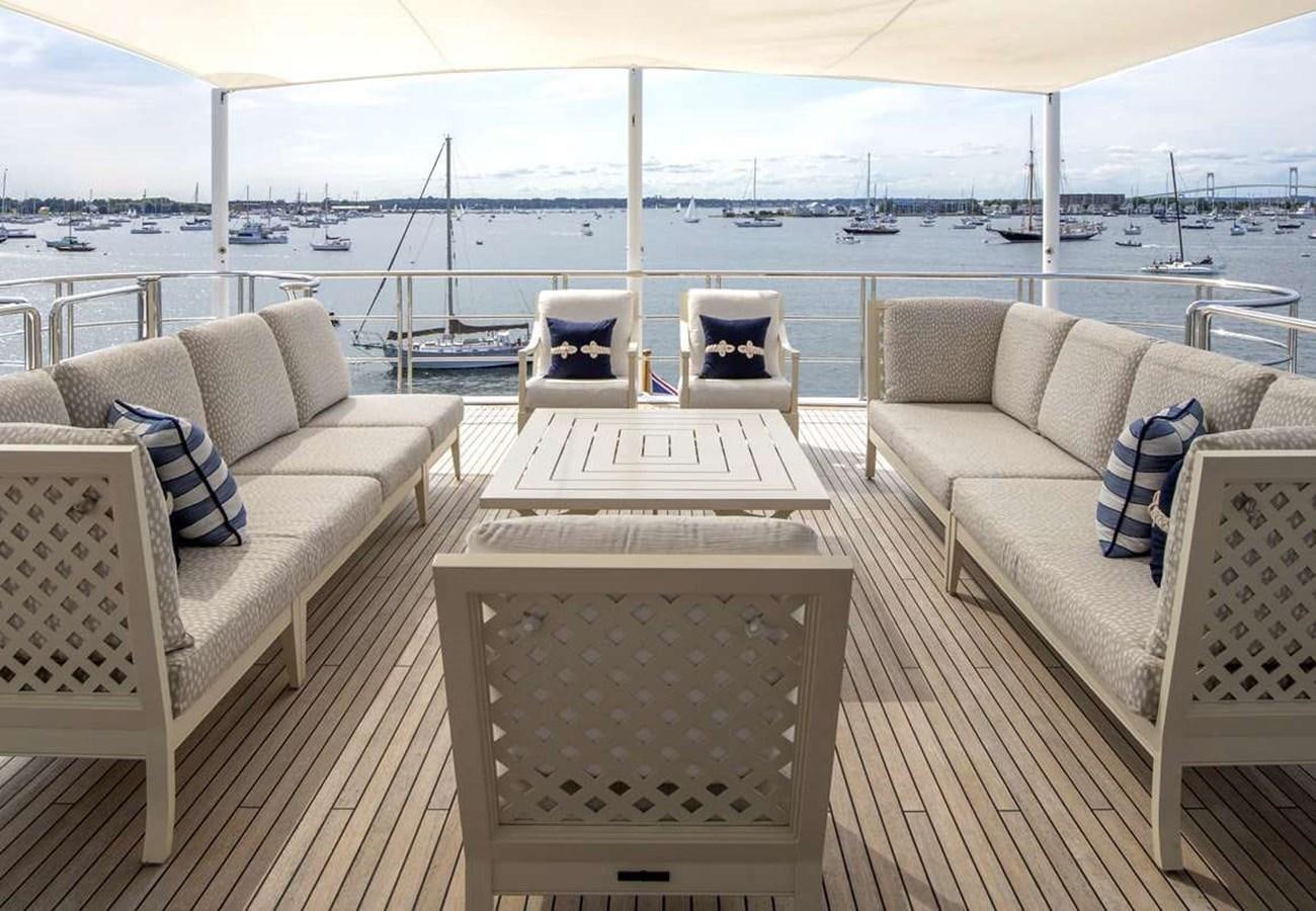 a living room with a view of the water aboard BELLA VITA Yacht for Sale