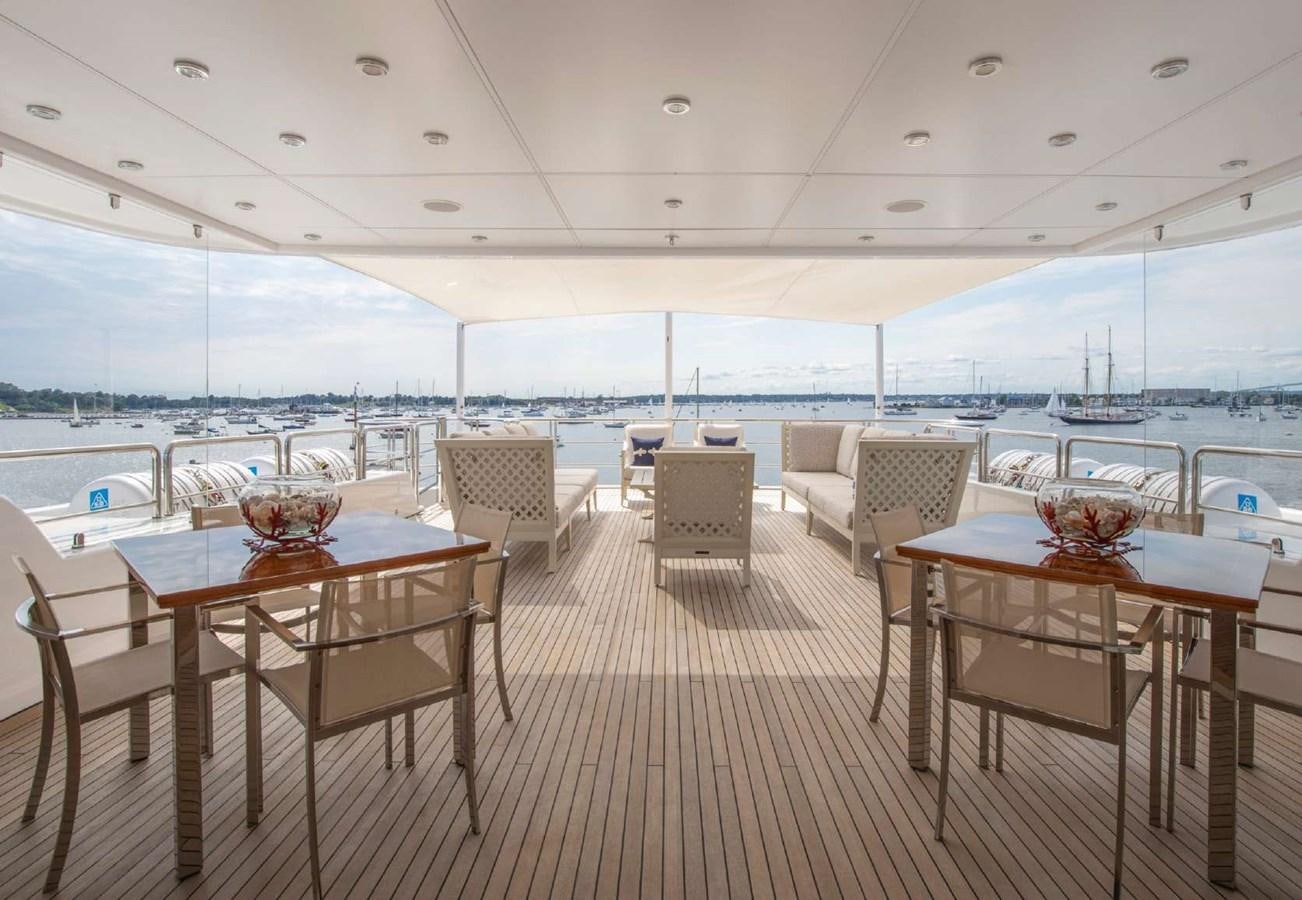 a room with a table and chairs aboard BELLA VITA Yacht for Sale
