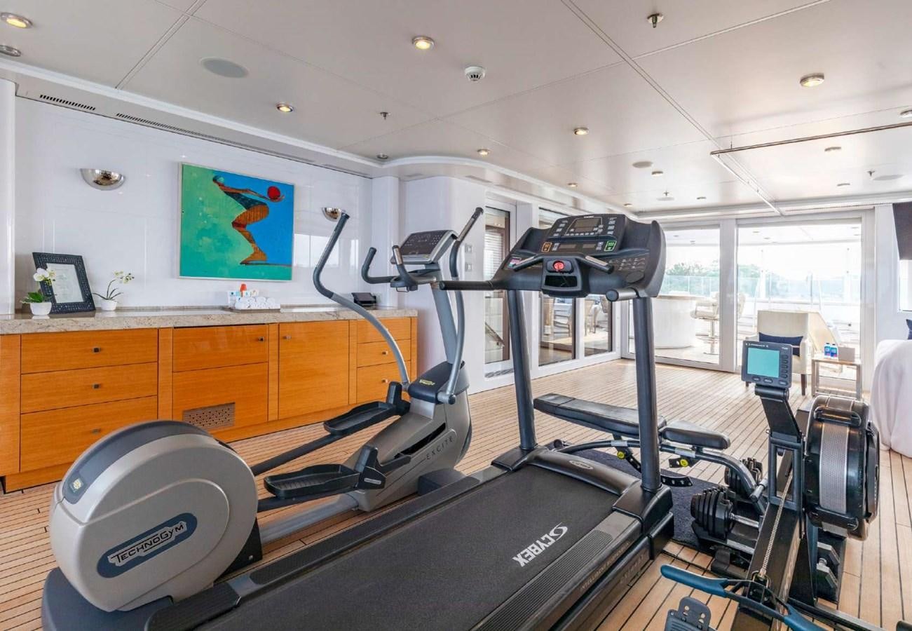 a gym with equipment aboard BELLA VITA Yacht for Sale