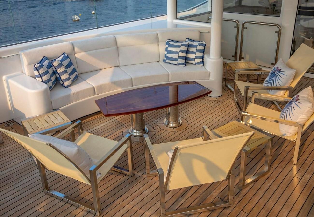 a boat with tables and chairs aboard BELLA VITA Yacht for Sale