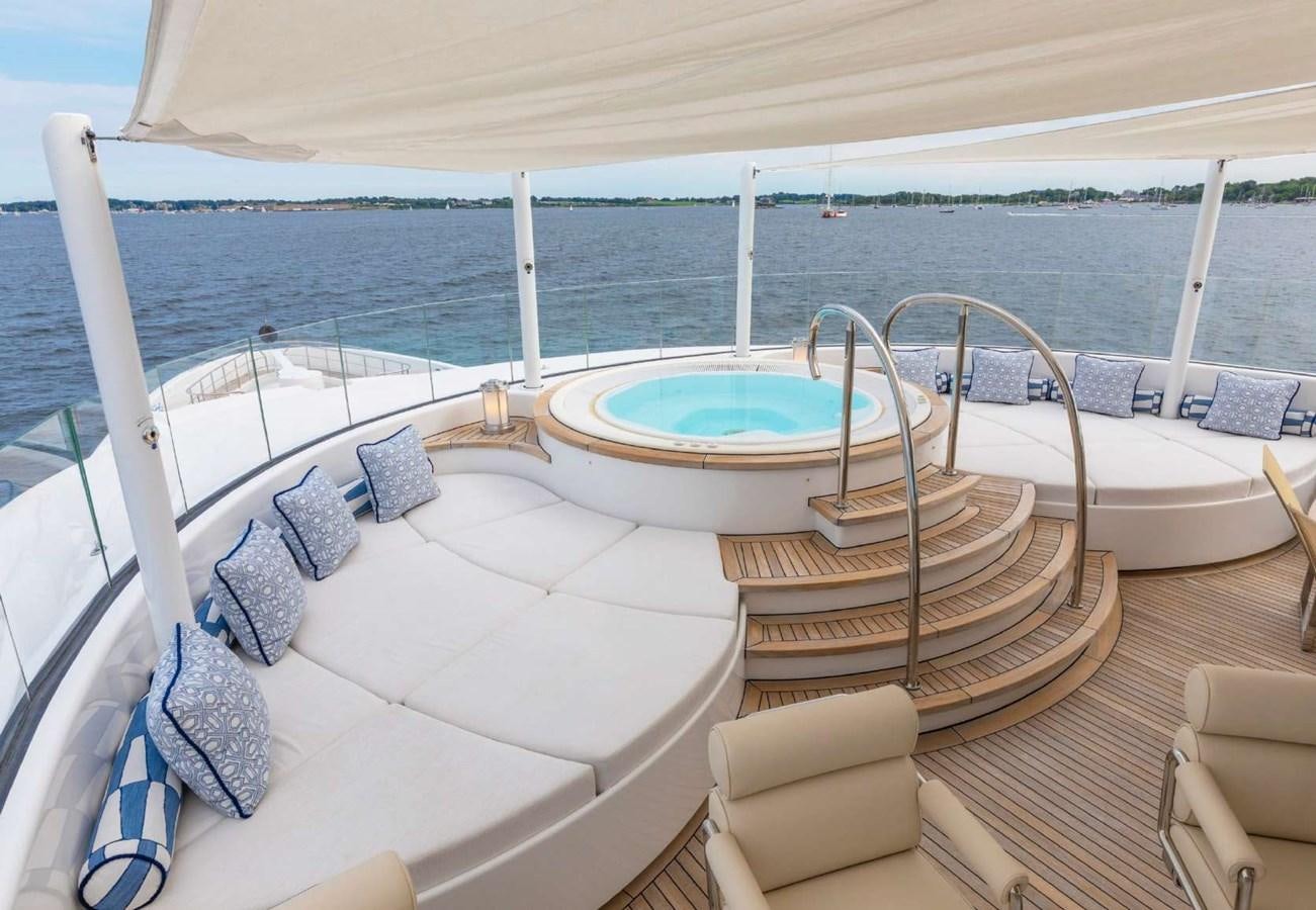 a large swimming pool on a deck aboard BELLA VITA Yacht for Sale