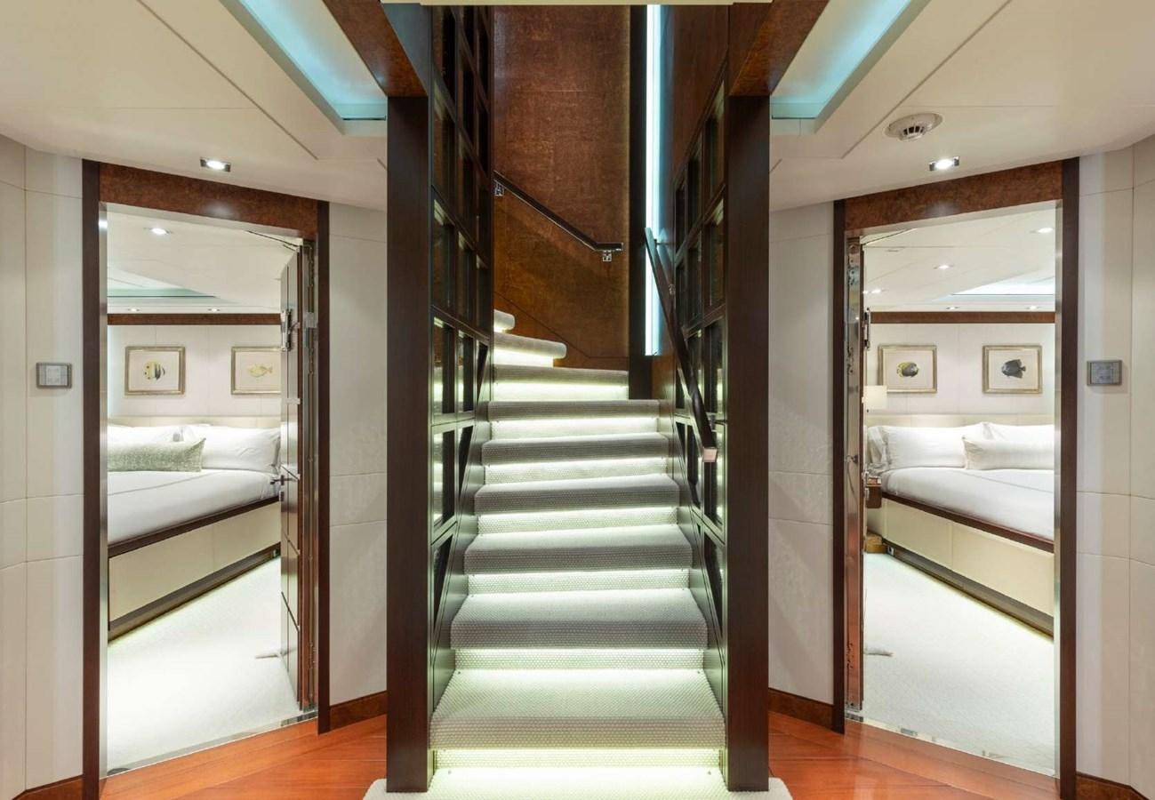 a modern looking room with a set of stairs aboard BELLA VITA Yacht for Sale