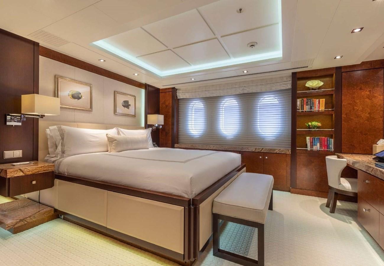 a bedroom with a large bed aboard BELLA VITA Yacht for Sale