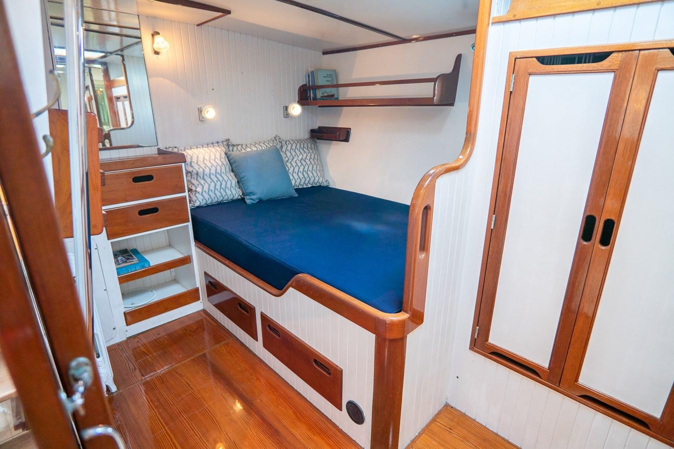 a bed in a room aboard PIAFFE Yacht for Sale
