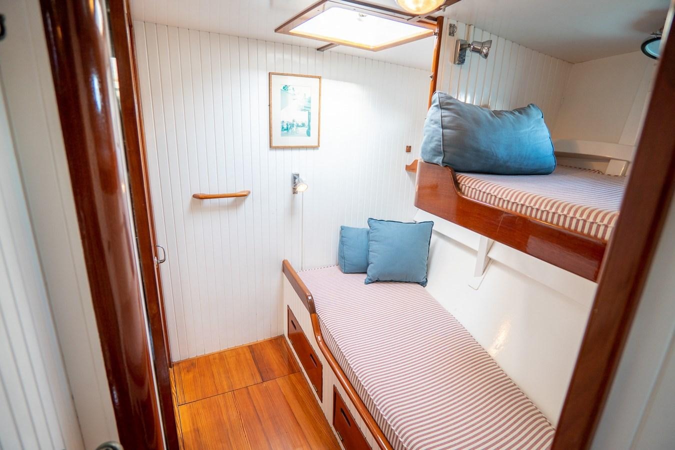 a room with two beds aboard PIAFFE Yacht for Sale