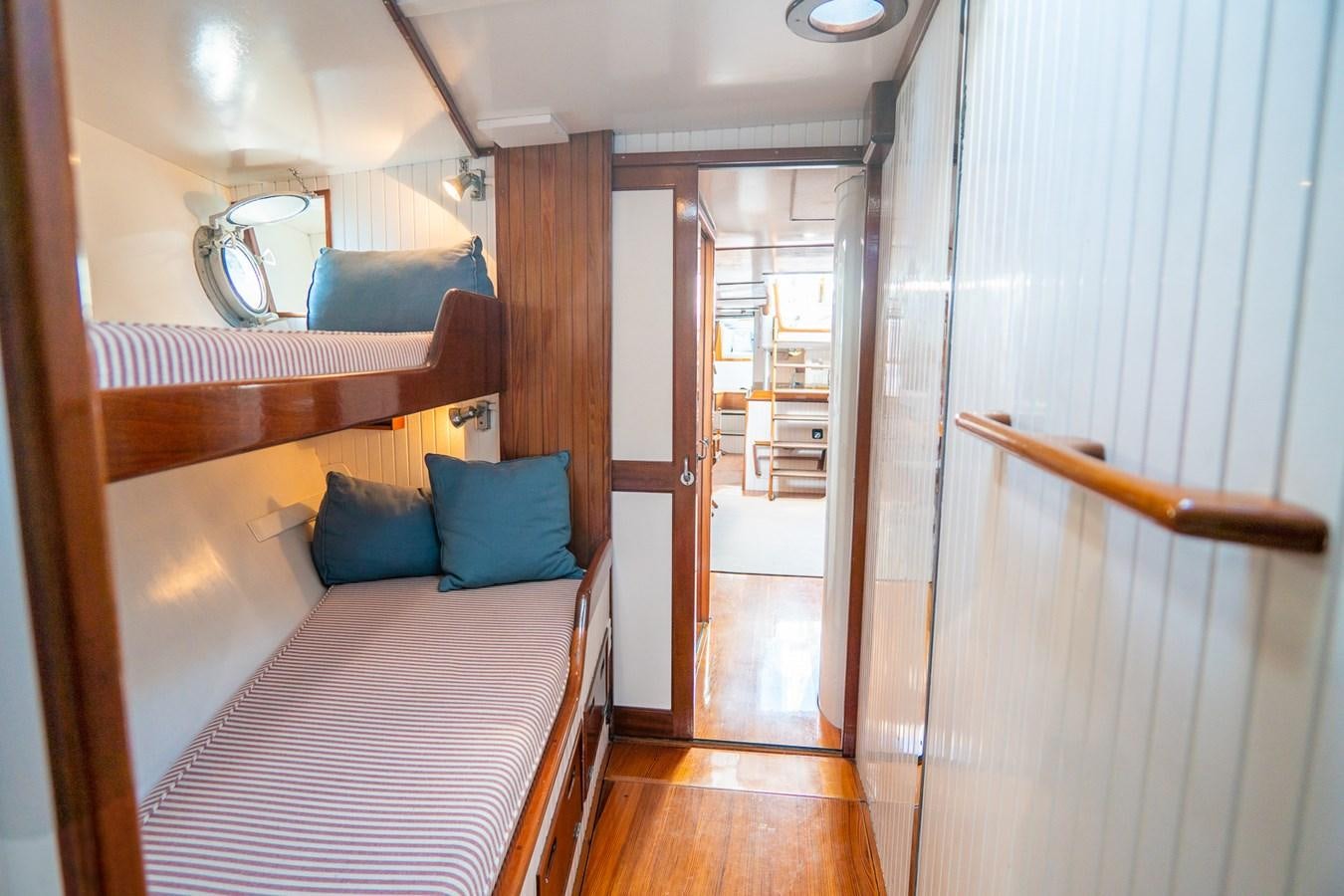 a bed in a room aboard PIAFFE Yacht for Sale