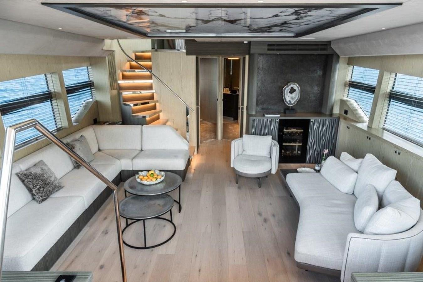 a living room with a fireplace aboard ST. BARTH Yacht for Sale