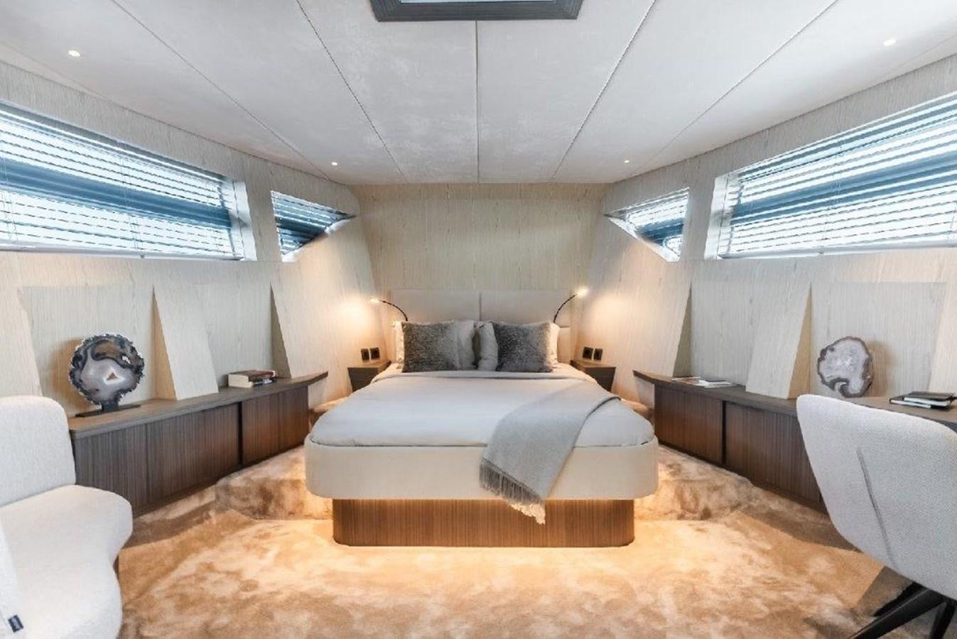a bedroom with a large bed aboard ST. BARTH Yacht for Sale