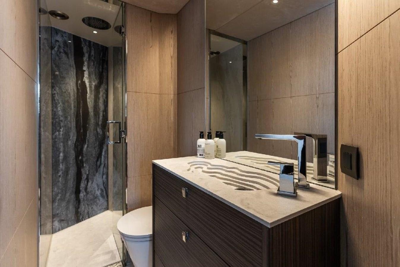 a bathroom with a countertop sink and a shower curtain aboard ST. BARTH Yacht for Sale
