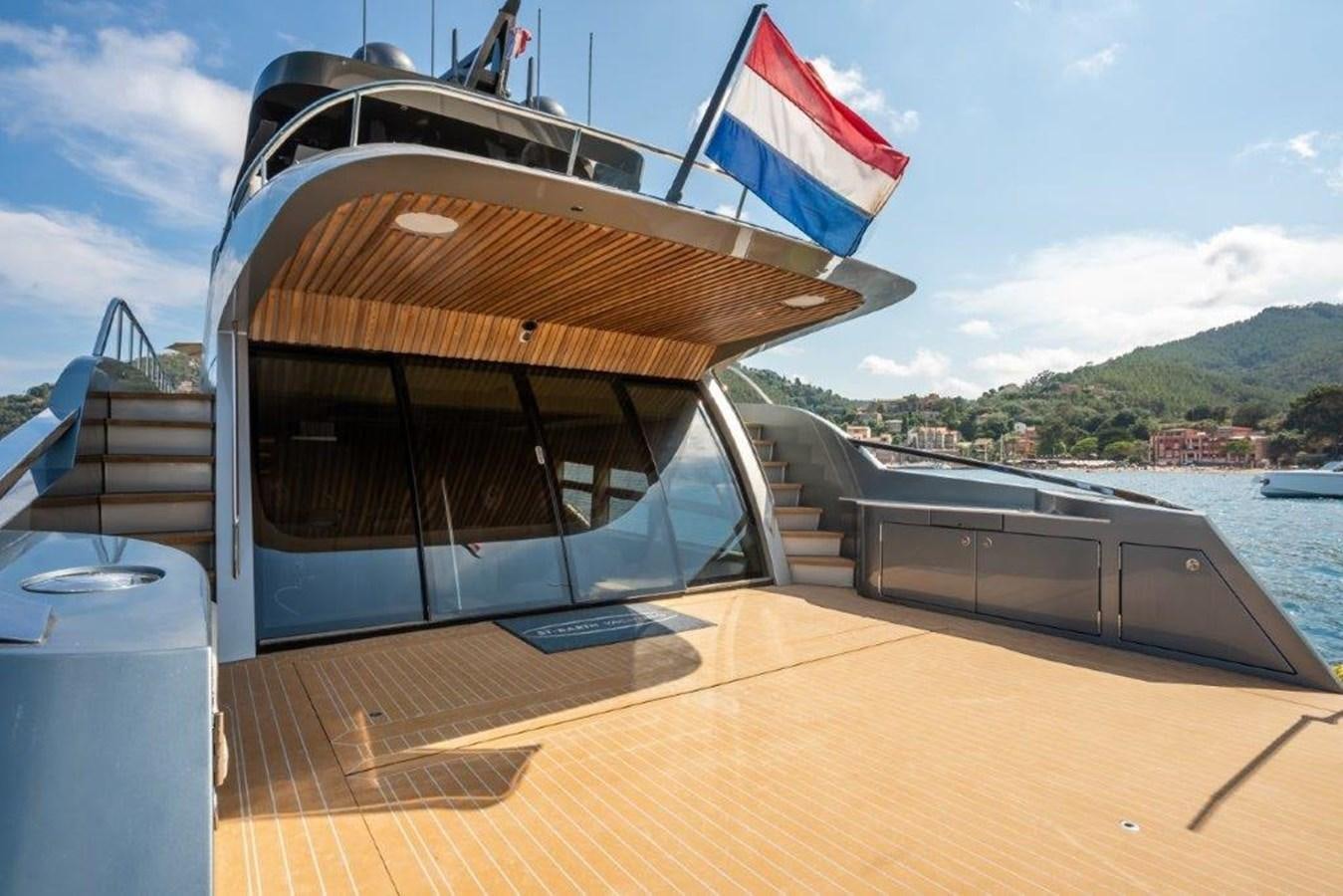 a boat with a flag on the front aboard ST. BARTH Yacht for Sale
