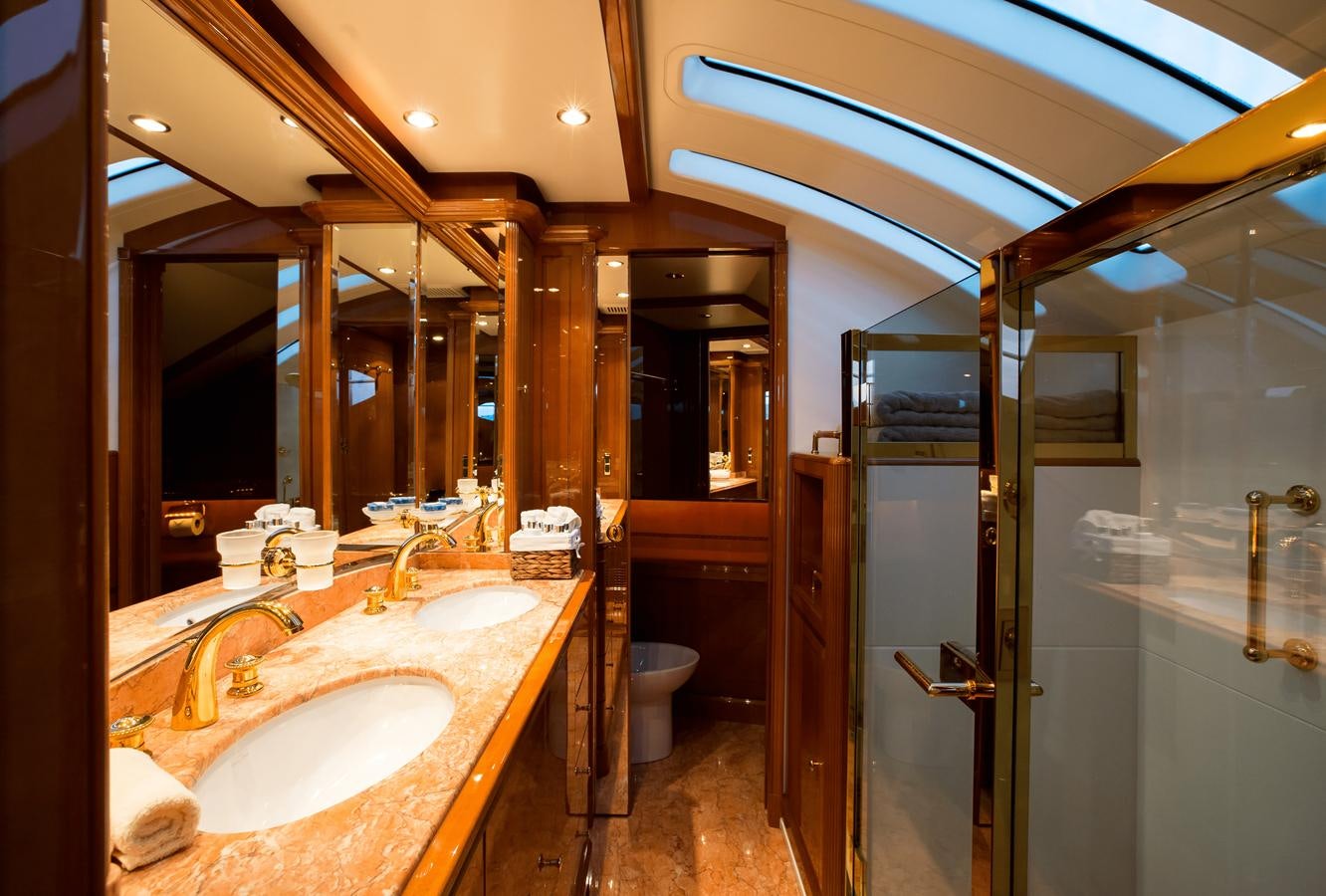 a bathroom with a sink and a mirror aboard REBECCA V Yacht for Sale