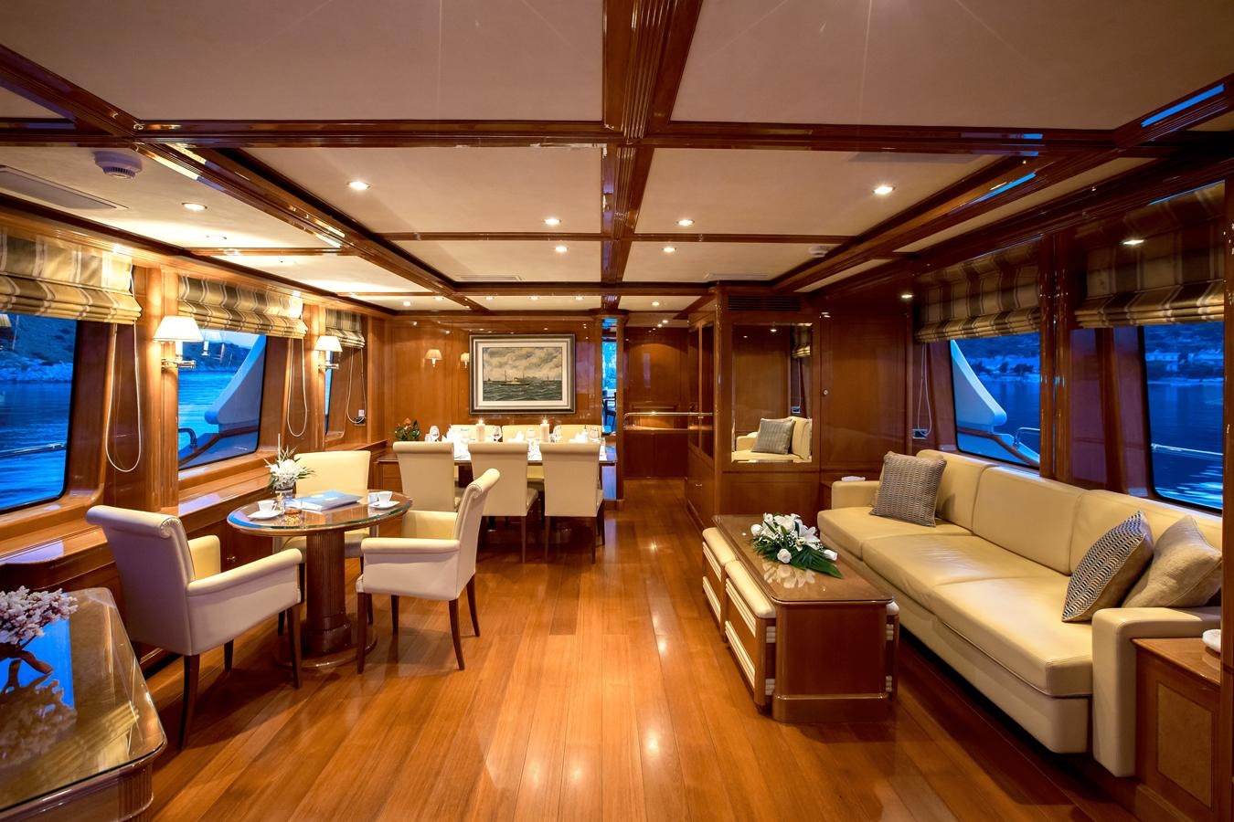 a living room with a wood floor aboard REBECCA V Yacht for Sale