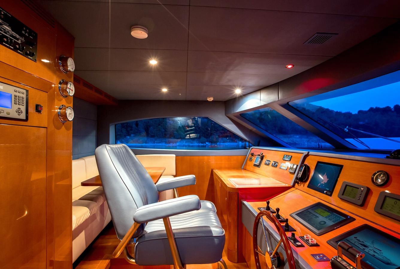 a room with a desk and chairs aboard REBECCA V Yacht for Sale