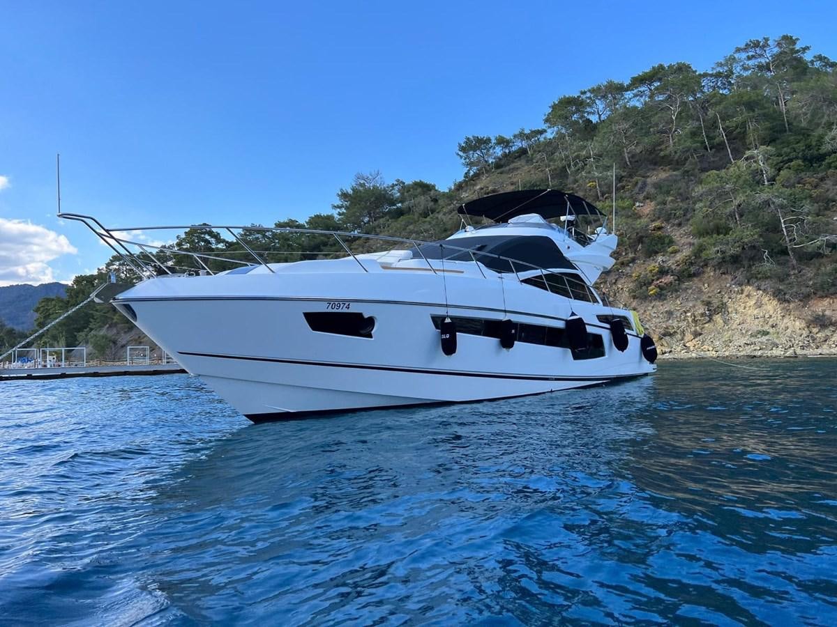 a white yacht in the water aboard ESCAPE Yacht for Sale