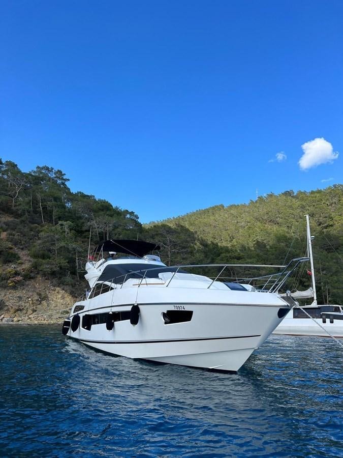 a white boat on water aboard ESCAPE Yacht for Sale