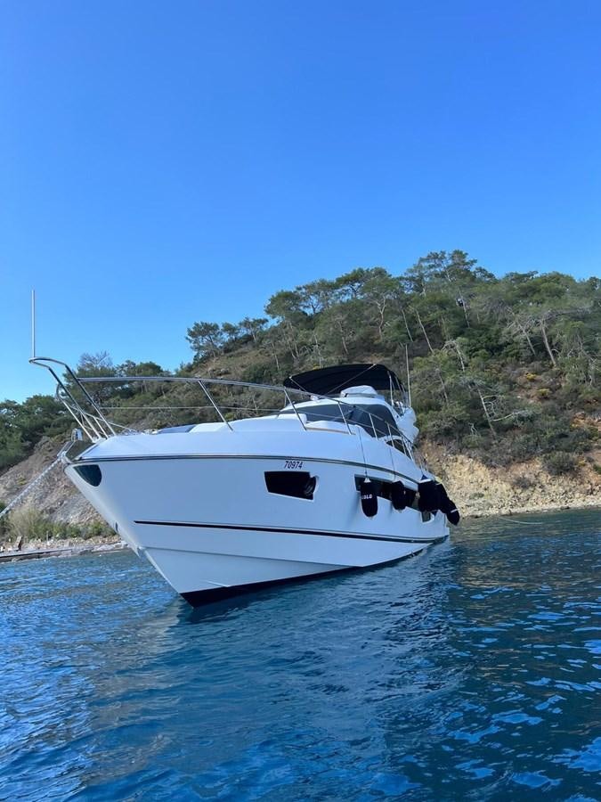 a white boat in the water aboard ESCAPE Yacht for Sale