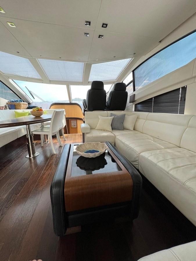 a room with a couch and a table aboard ESCAPE Yacht for Sale