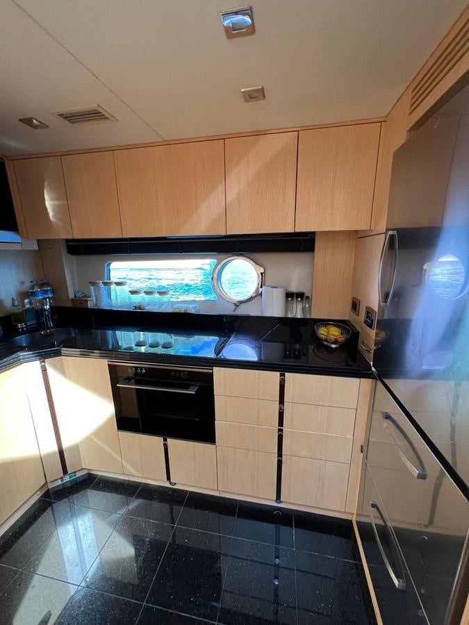 a kitchen with a stove and oven aboard ESCAPE Yacht for Sale