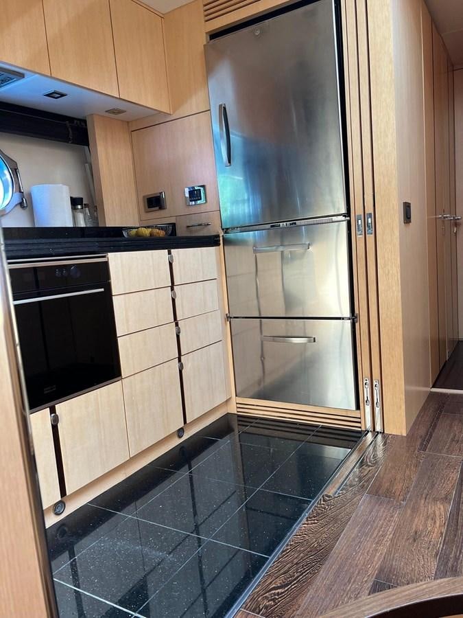 a kitchen with stainless steel appliances aboard ESCAPE Yacht for Sale
