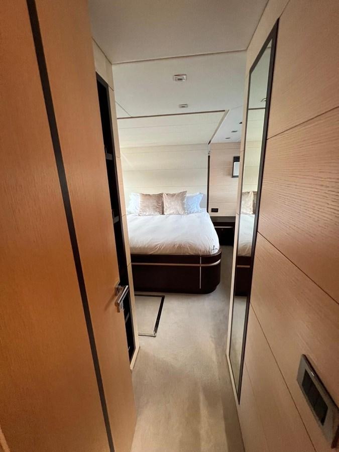a bedroom with a bed aboard ESCAPE Yacht for Sale