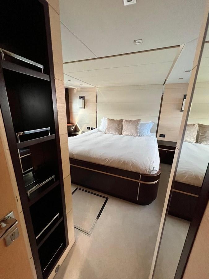 a bedroom with a bed aboard ESCAPE Yacht for Sale