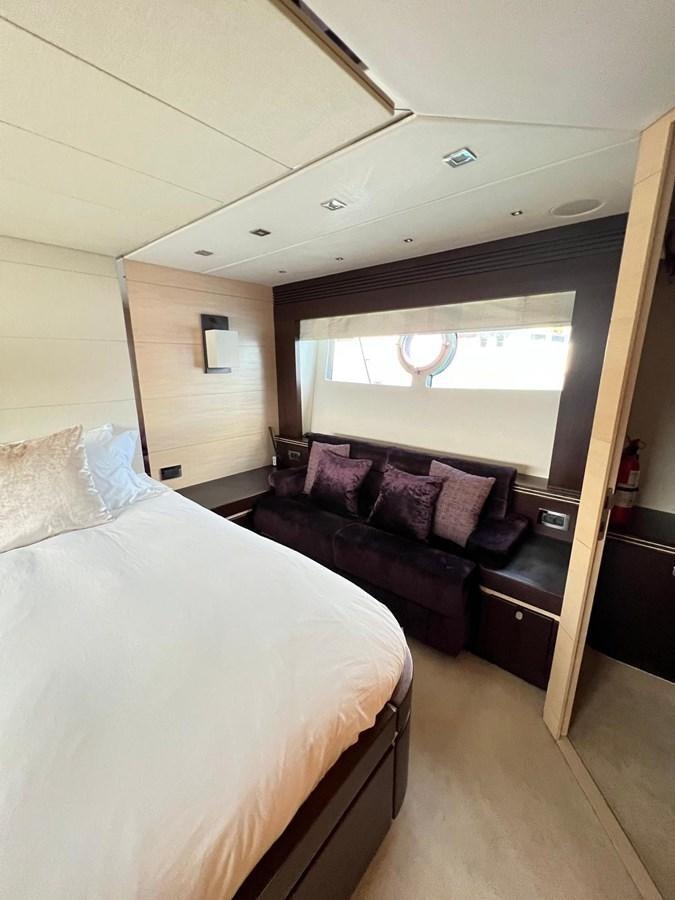 a bed and a couch in a room aboard ESCAPE Yacht for Sale