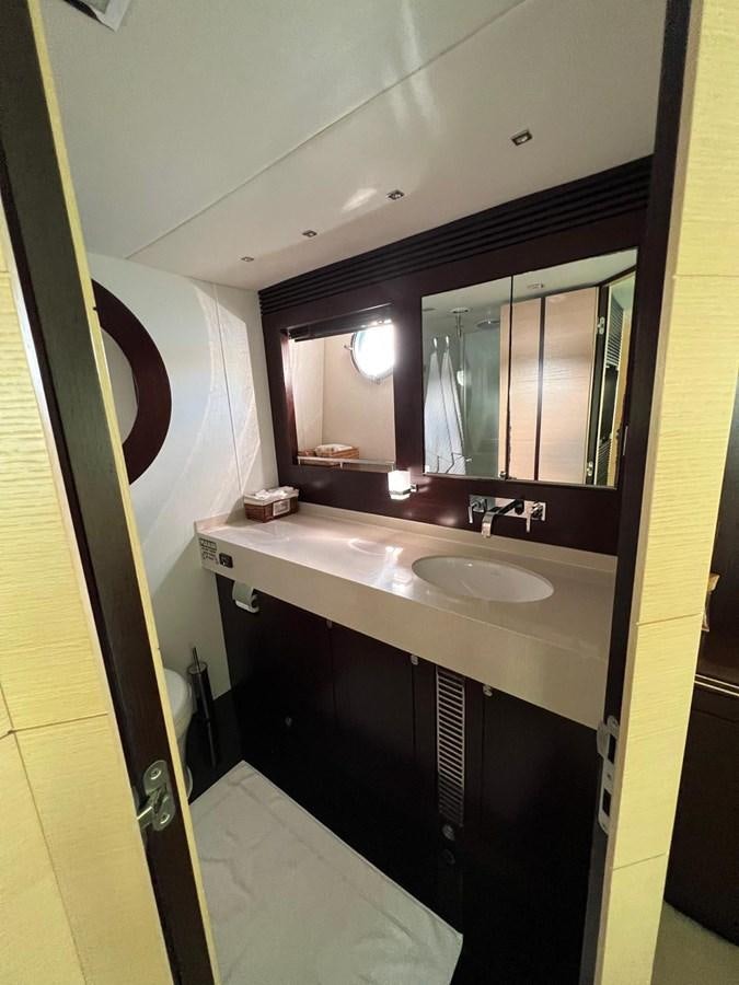 a bathroom with a large mirror aboard ESCAPE Yacht for Sale