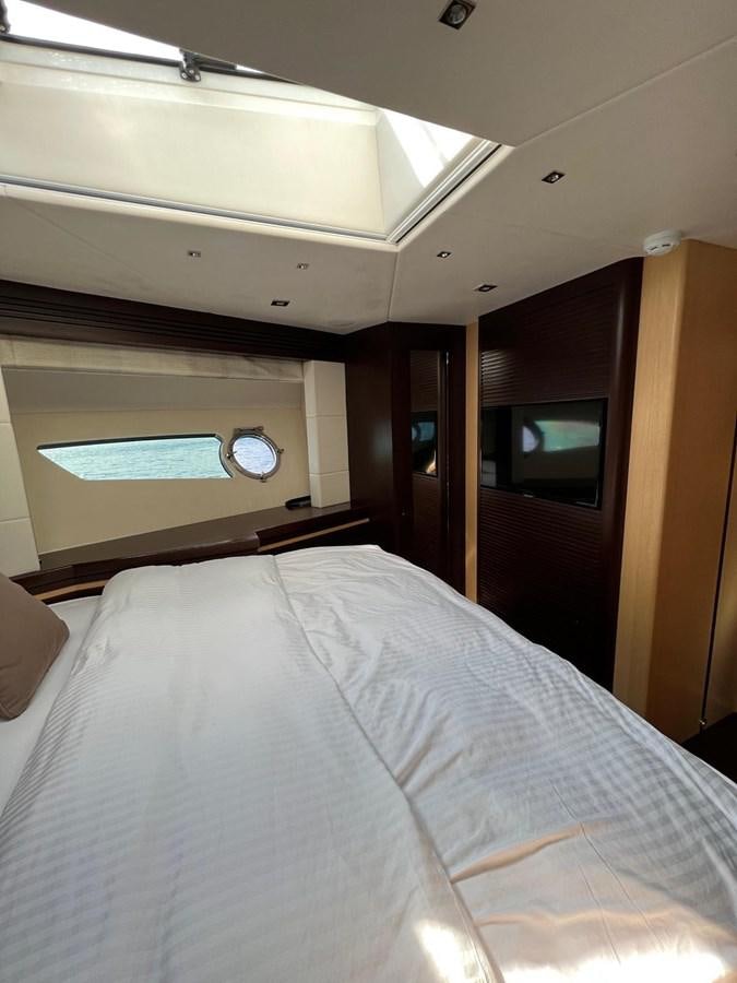 a bed with a white sheet aboard ESCAPE Yacht for Sale