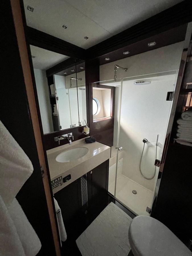 a bathroom with a sink and mirror aboard ESCAPE Yacht for Sale