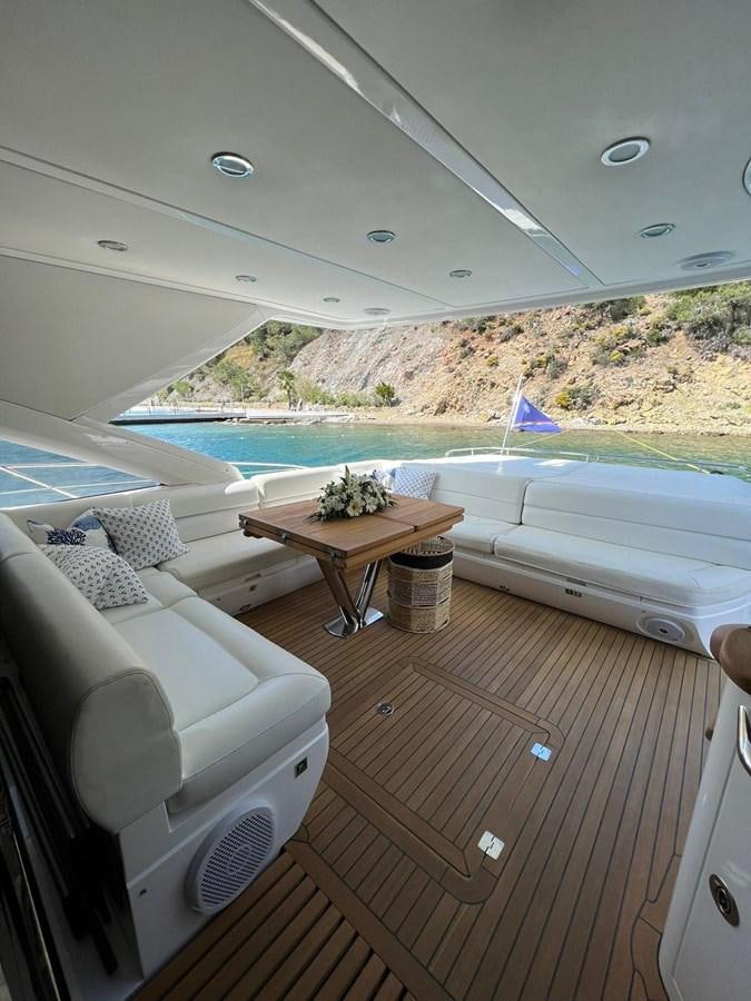 a room with a table and chairs aboard ESCAPE Yacht for Sale