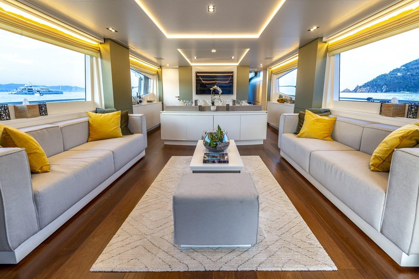 a living room with a couch and a coffee table aboard MANATEA Yacht for Sale