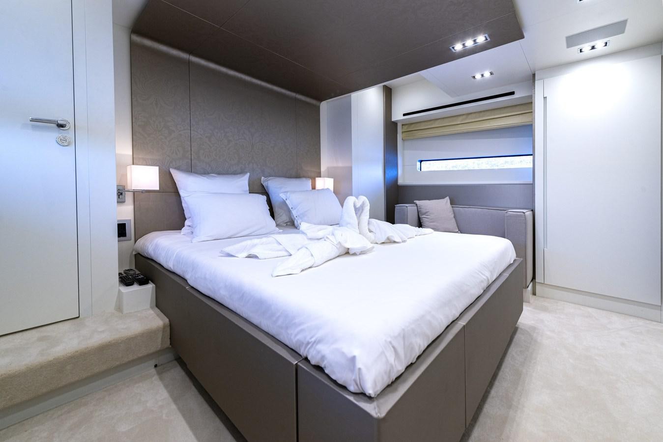 a bed in a room aboard MANATEA Yacht for Sale