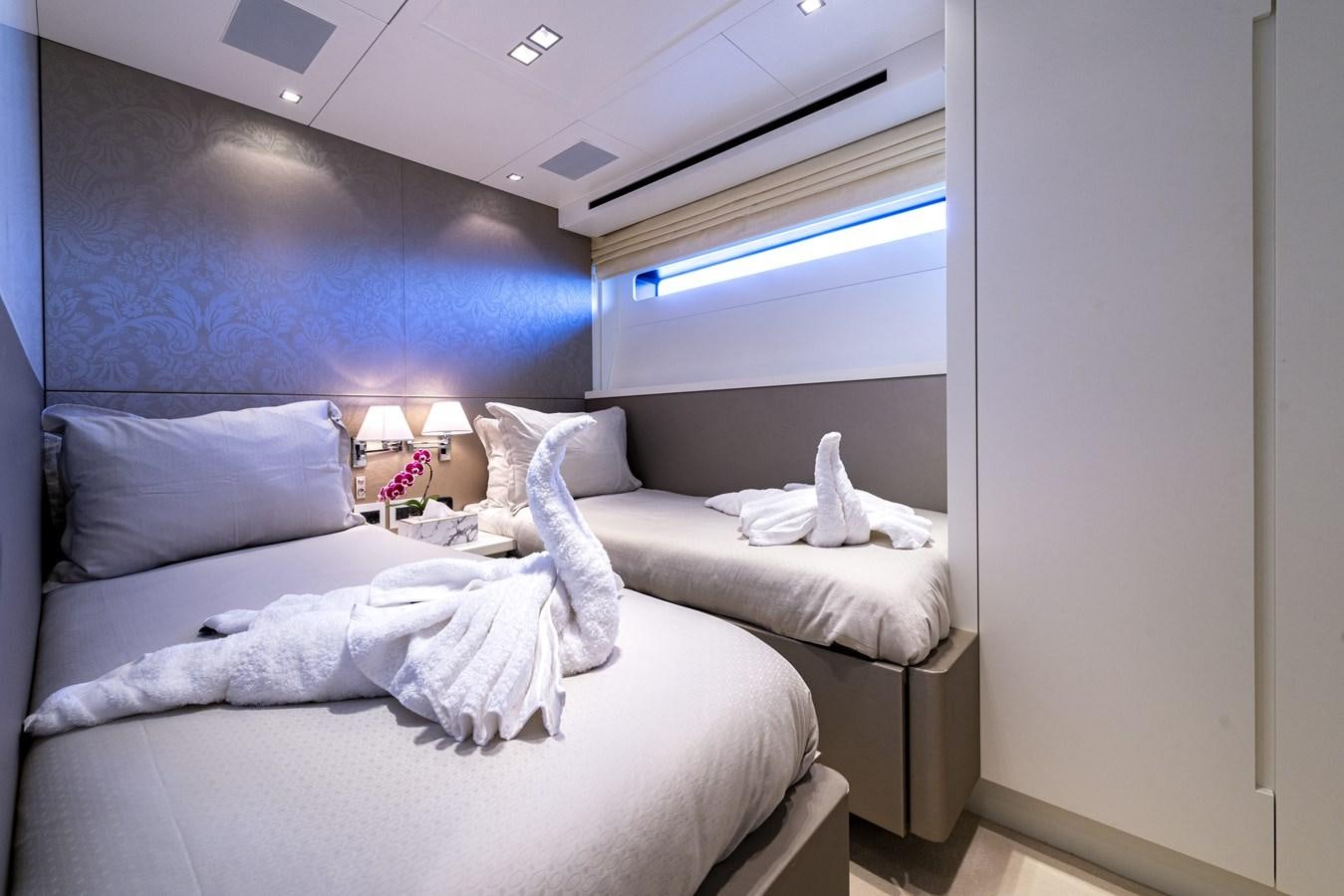 a room with two beds aboard MANATEA Yacht for Sale