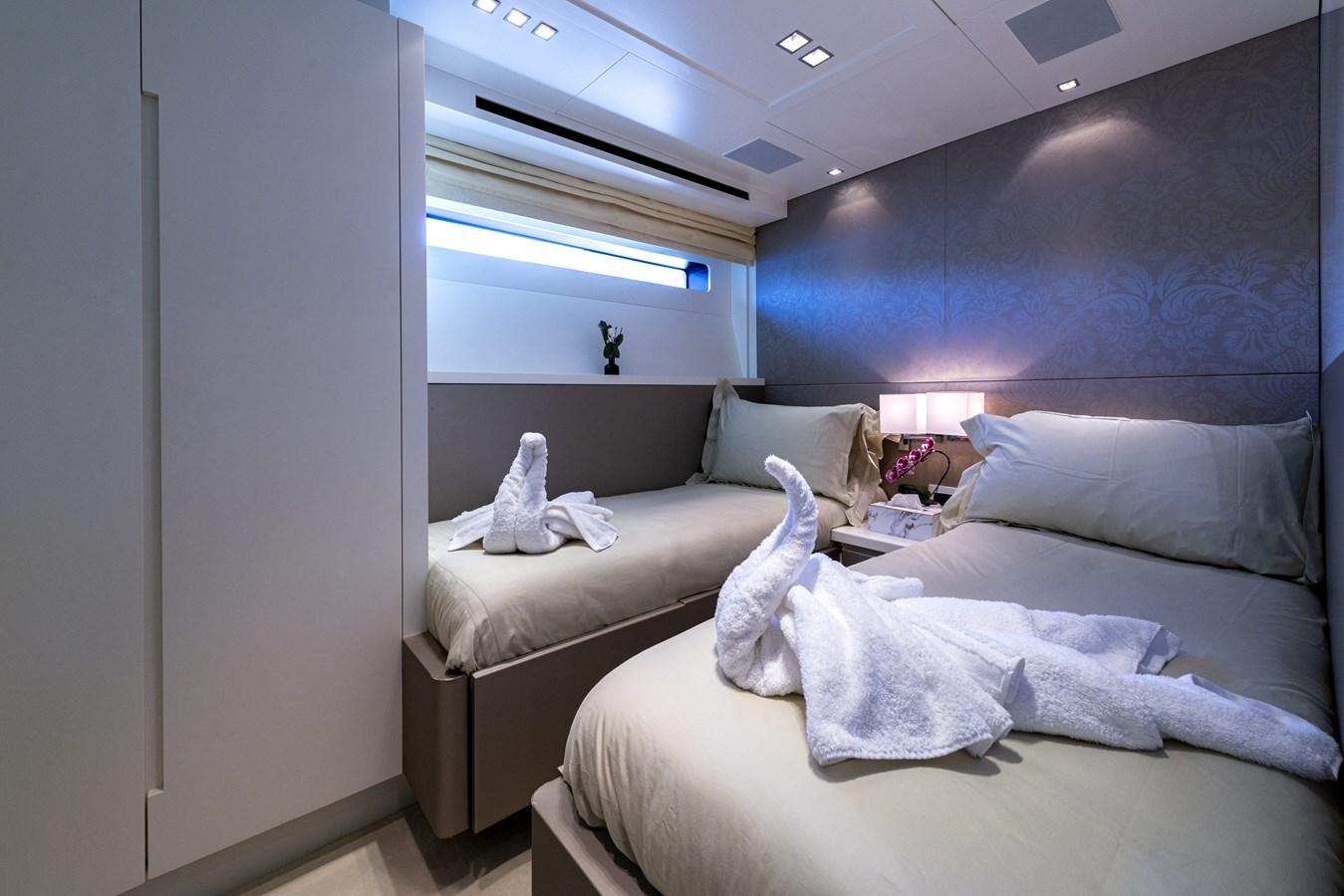 a room with two beds aboard MANATEA Yacht for Sale