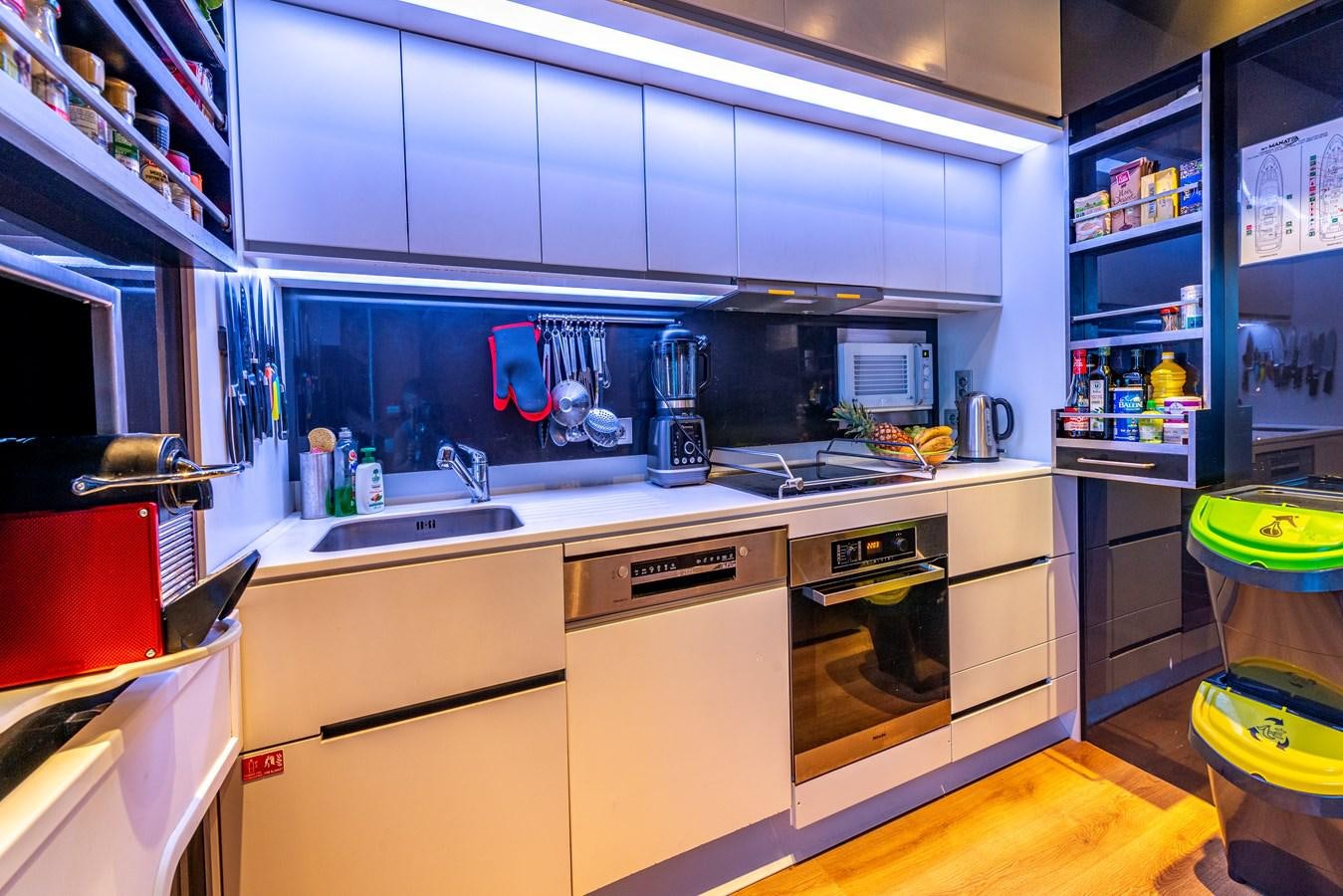 a kitchen with a lot of clutter aboard MANATEA Yacht for Sale