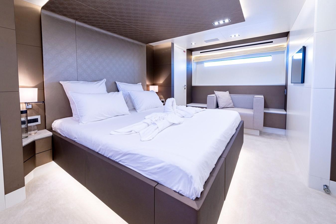 a room with a bed and a desk aboard MANATEA Yacht for Sale