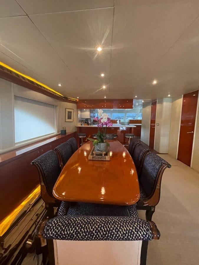 a dining table in a room aboard GAVIOTA III Yacht for Sale