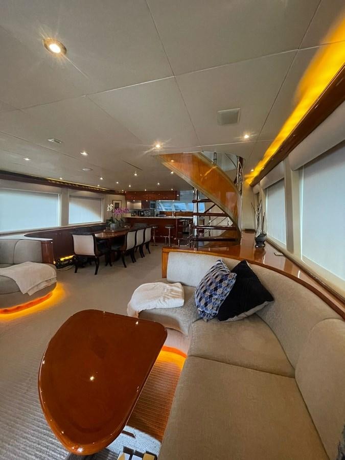 a living room with a staircase aboard GAVIOTA III Yacht for Sale