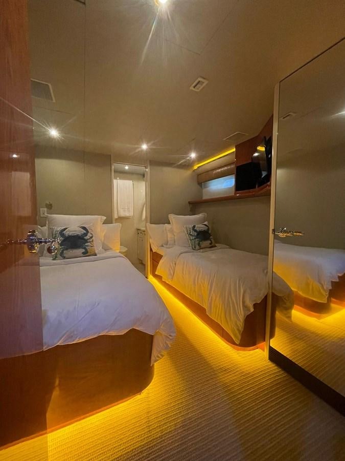a room with a couple beds aboard GAVIOTA III Yacht for Sale