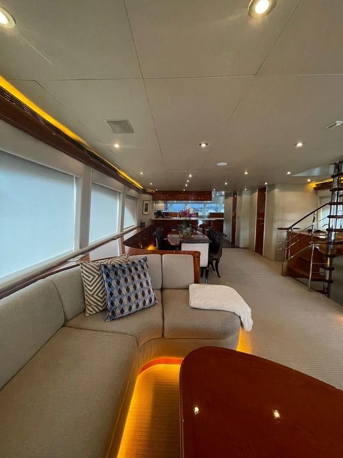 a living room with a couch and chairs aboard GAVIOTA III Yacht for Sale