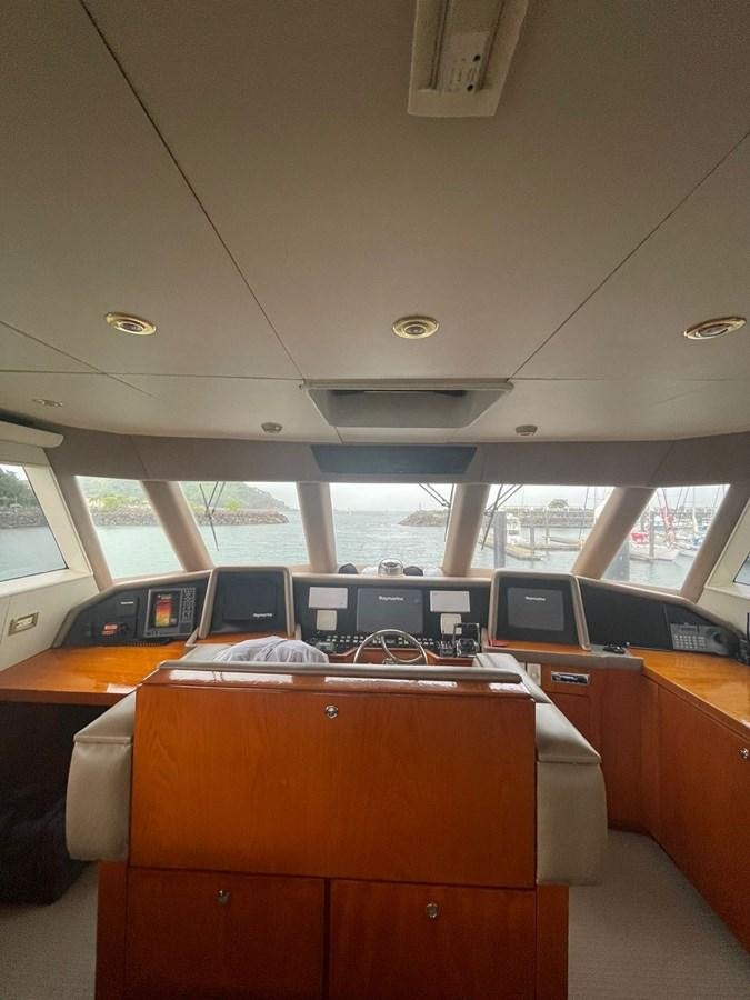a room with laptops on desks aboard GAVIOTA III Yacht for Sale