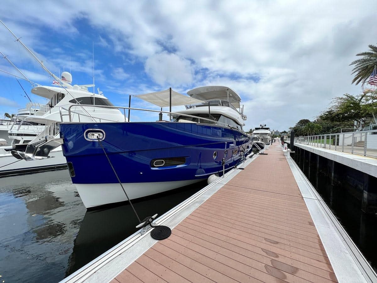 a boat docked at a pier aboard PURA VIDA Yacht for Sale