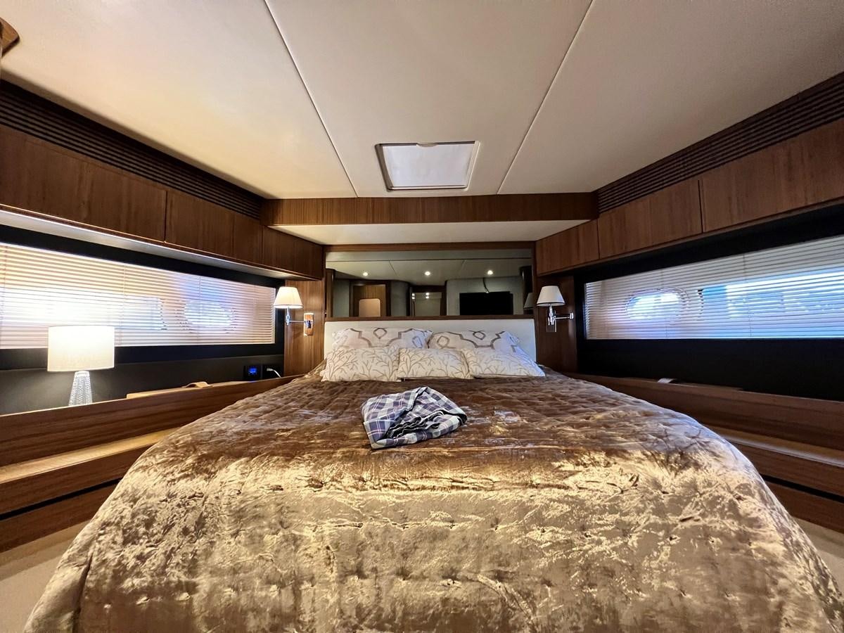 a bed in a room aboard PURA VIDA Yacht for Sale