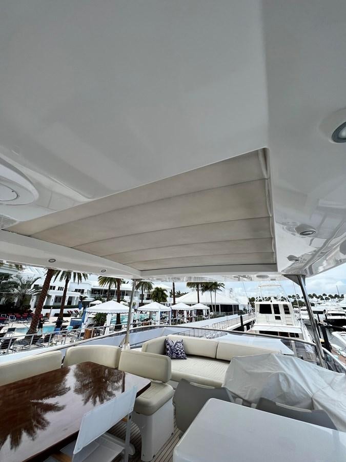 a boat with white chairs aboard PURA VIDA Yacht for Sale