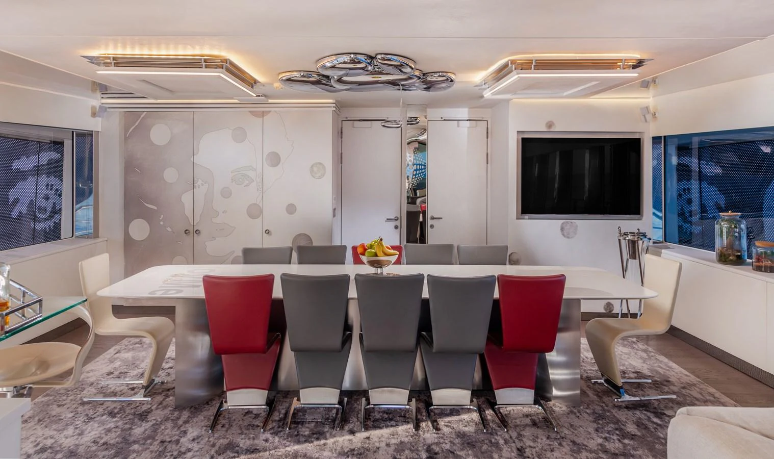 a room with chairs and a table aboard JOY ME Yacht for Sale
