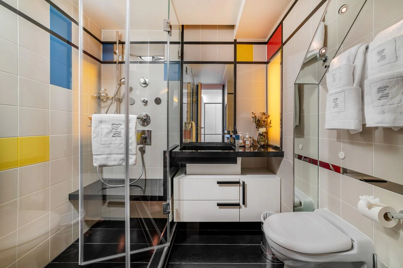 a bathroom with a glass shower aboard JOY ME Yacht for Sale