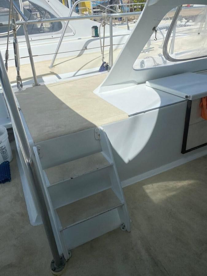 a white metal bench aboard 1996 GOLD COAST GC 70 Yacht for Sale