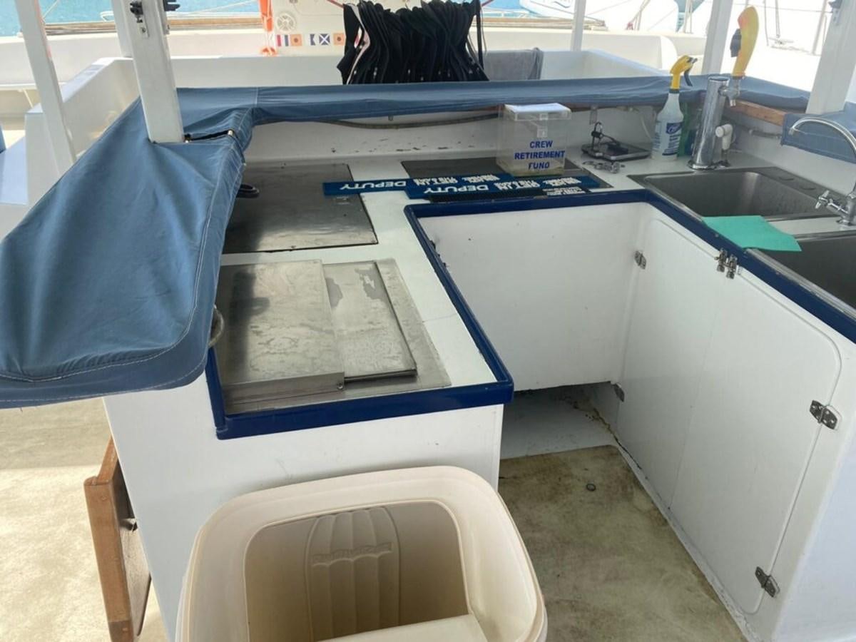 a machine with a blue cover aboard 1996 GOLD COAST GC 70 Yacht for Sale