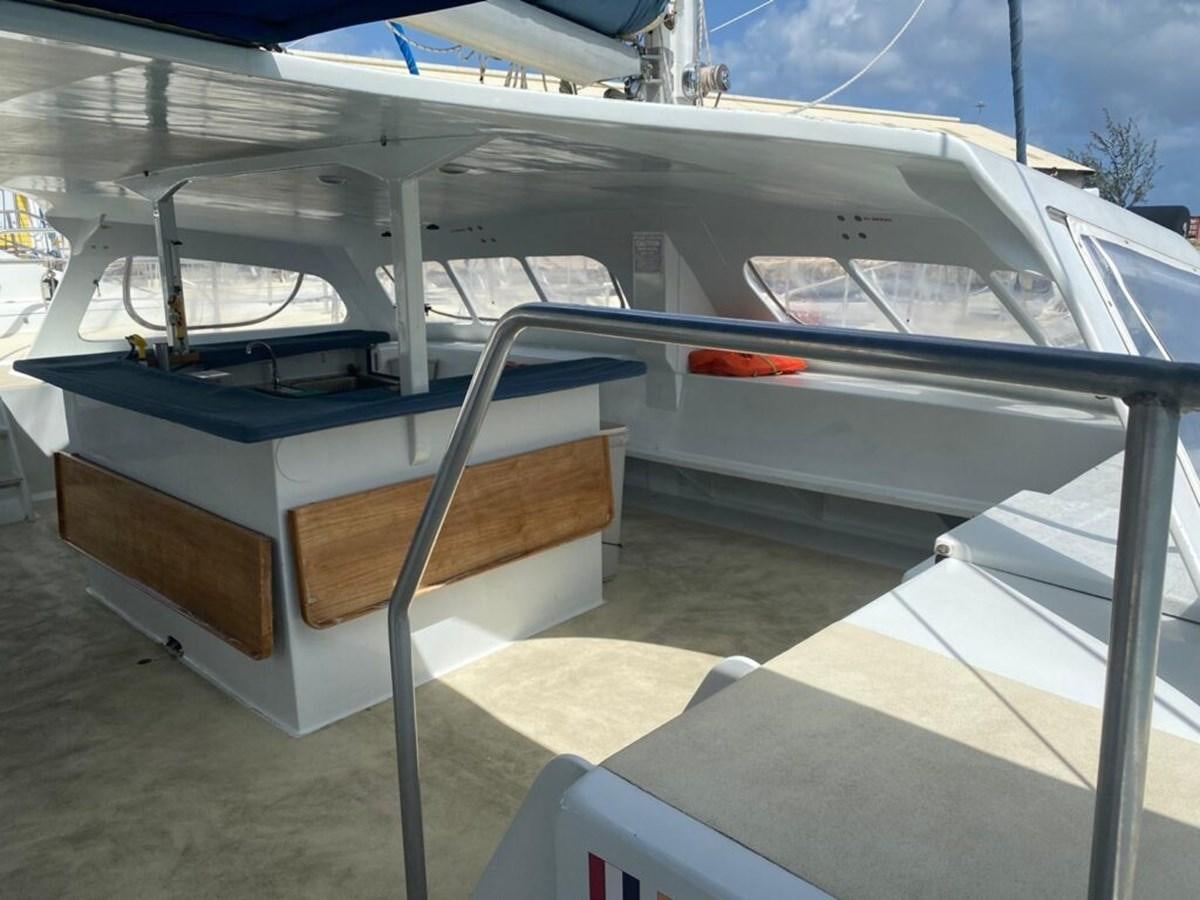 a row of white and black boats aboard 1996 GOLD COAST GC 70 Yacht for Sale