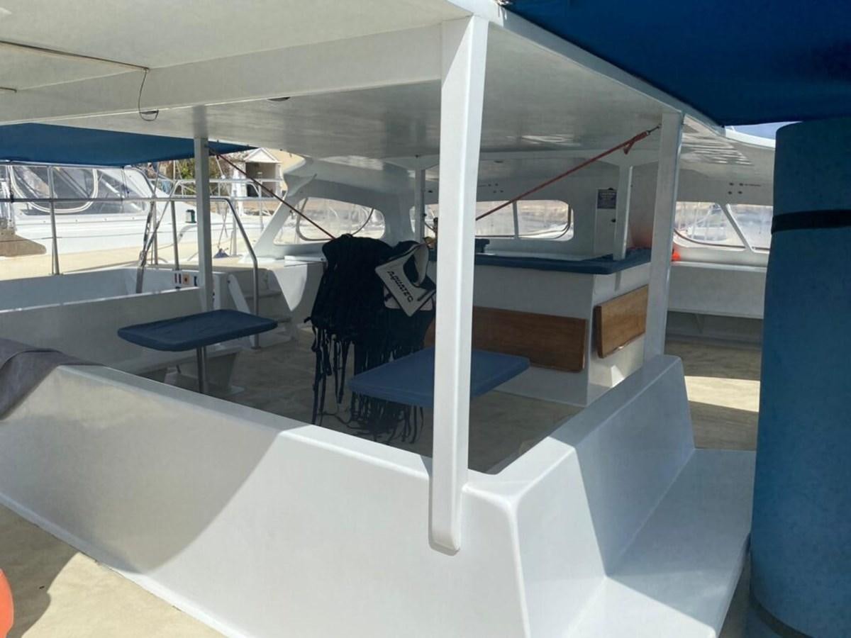 a boat with a person sitting on it aboard 1996 GOLD COAST GC 70 Yacht for Sale